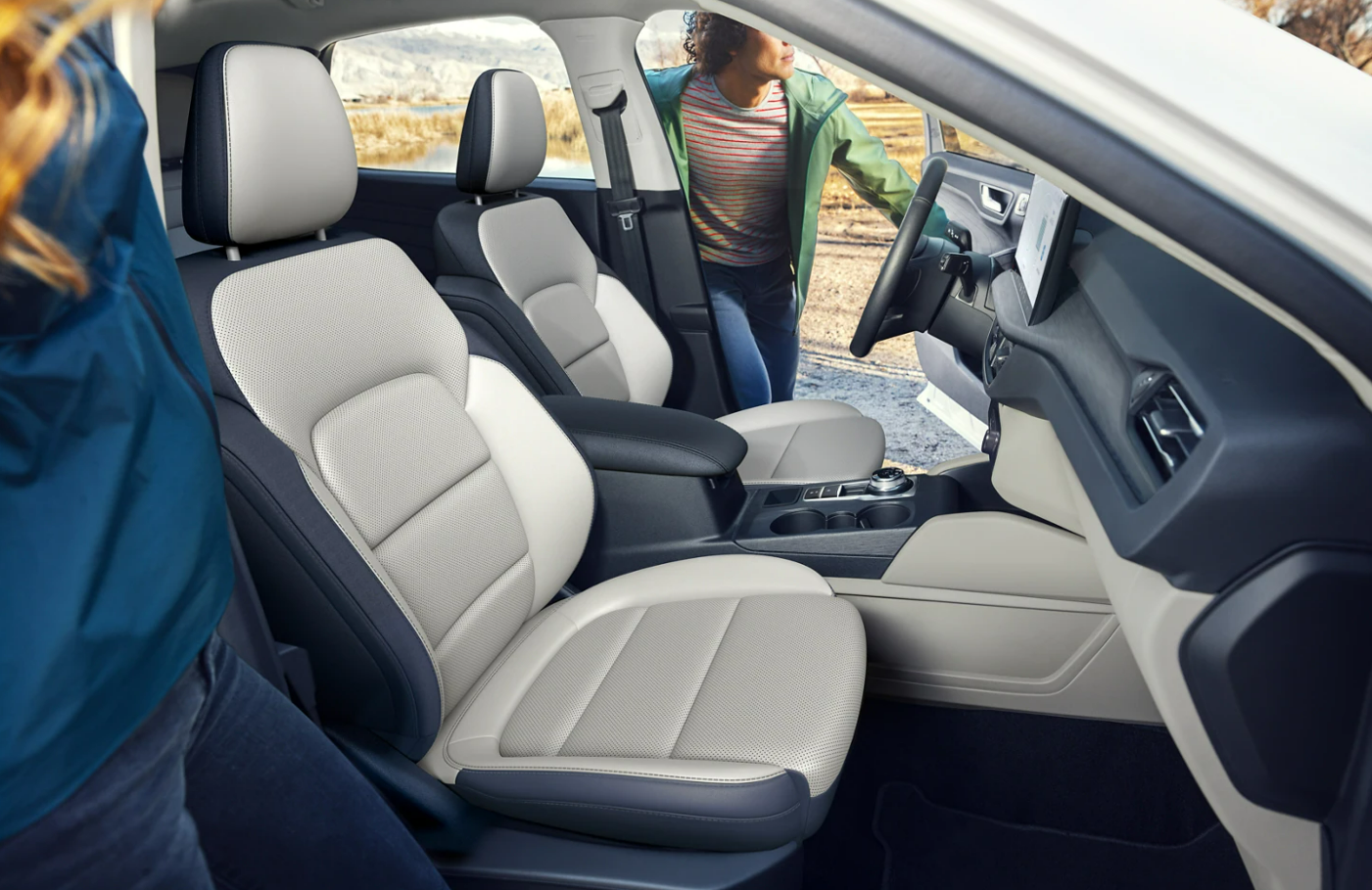 A view of the cabin and tow-toned gray upholstered seating of the 2023 Ford Escape