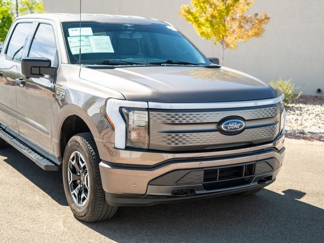 Used 2023 Ford F-150 Lightning XLT with VIN 1FTVW1EL6PWG29864 for sale in Santa Fe, NM