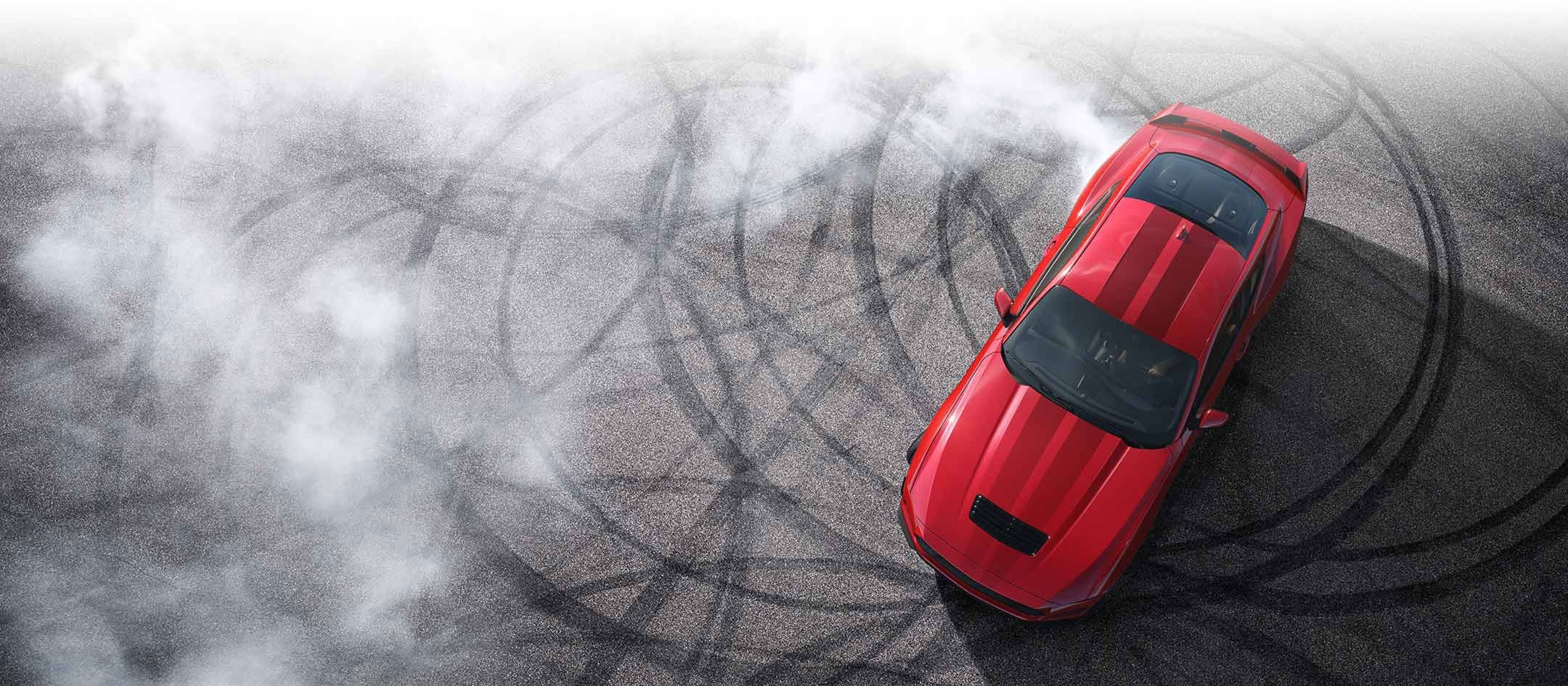 Overhead view of a 2024 Ford Mustang® model with tire tracks on pavement | Capitol Ford Santa Fe in Santa Fe NM
