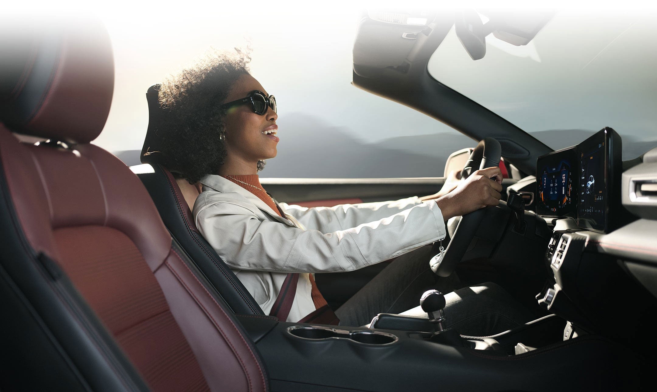 Person sitting in the driver’s seat of a 2024 Ford Mustang® convertible | Capitol Ford Santa Fe in Santa Fe NM