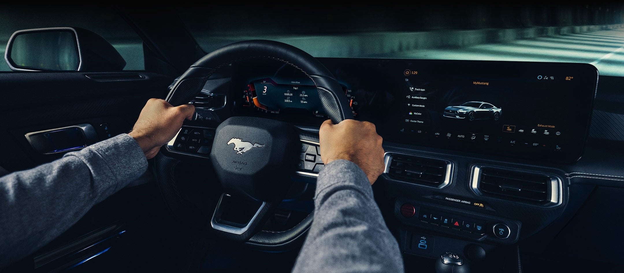 A 2024 Ford Mustang® model interior with a person driving | Capitol Ford Santa Fe in Santa Fe NM