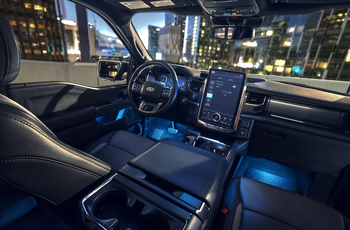 A view of the interior cabin, dash, and seating of a 2023 Ford F-150 Lightning